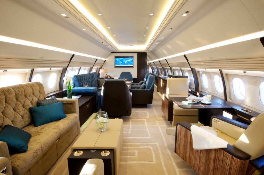 Airbus ACJ320 VIP lounge, sofas, wood and warm lighting